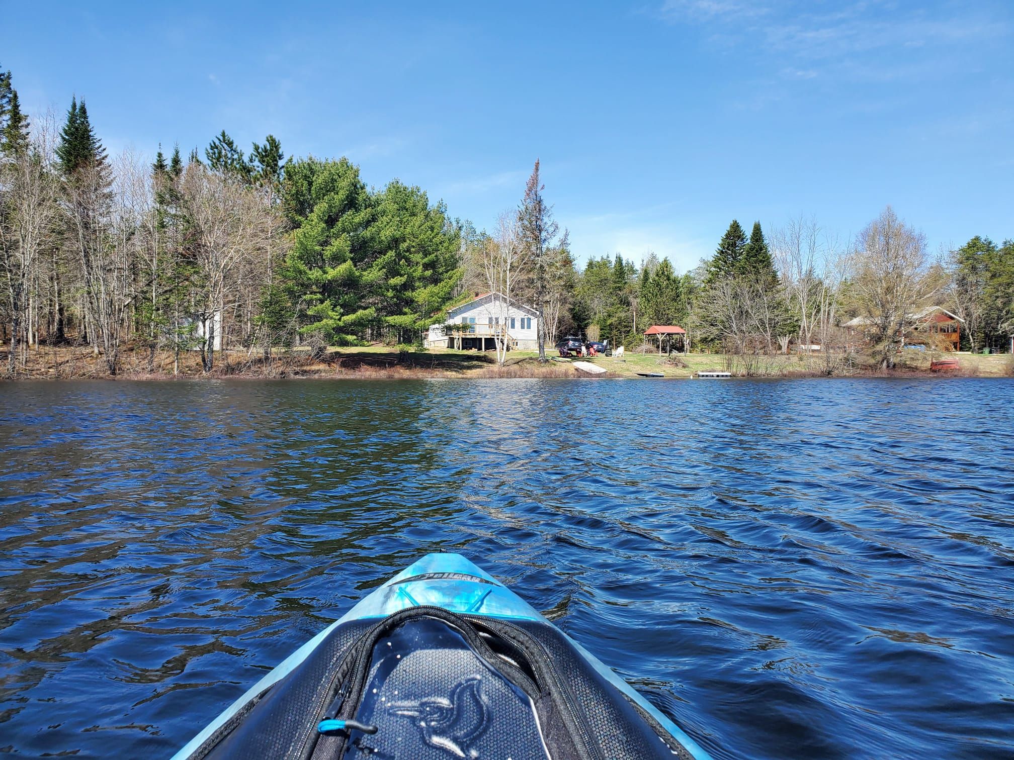 Chalet Nantel cottage viewed from a kayak on the lake